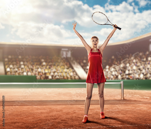 female tennis player on a tennis court holding a tennis racket above her head and celebrating a victory © TandemBranding