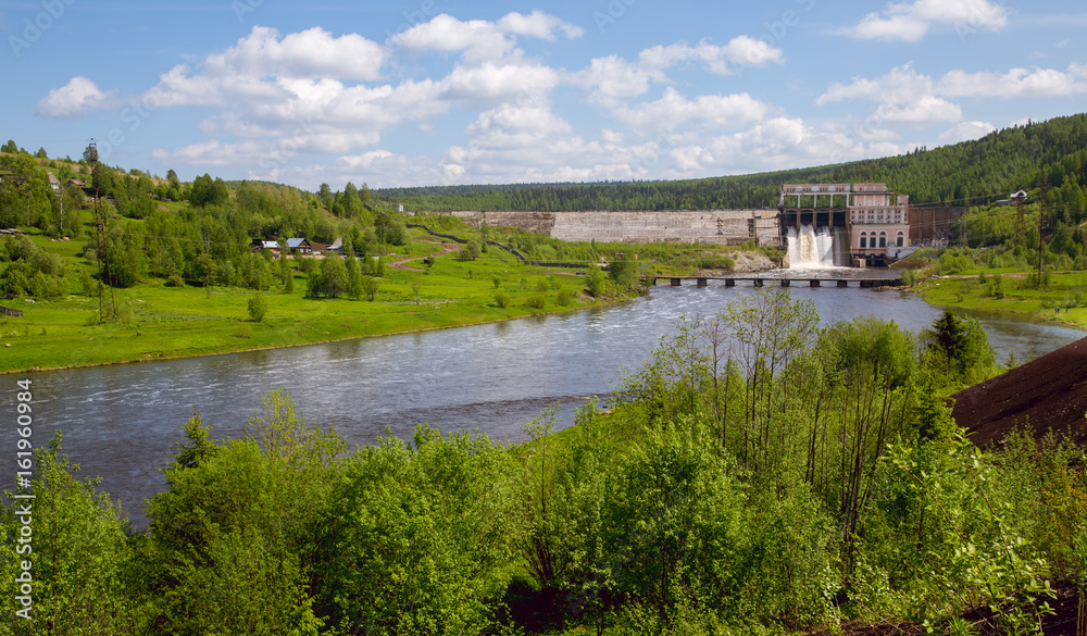 Panorama of hydroelectric power station on  sunny day