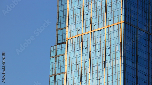 Abstract view of office building windows over a blue sky, for business concepts