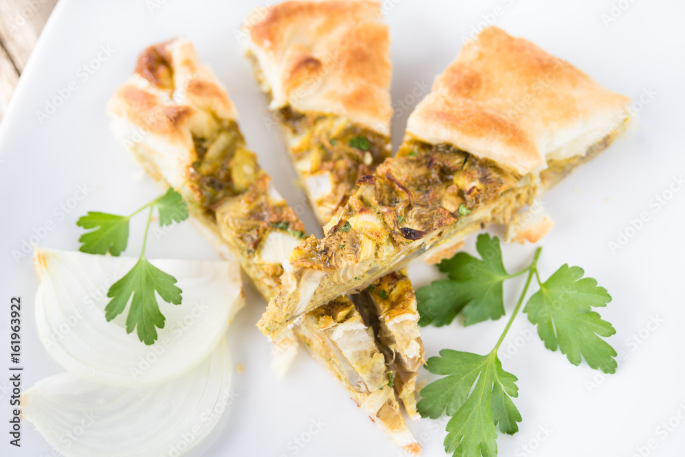 Salty pie with egg, artichoke and onion