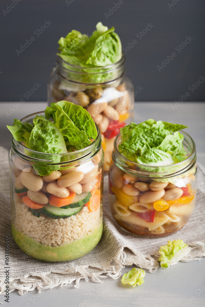 vegan couscous and pasta salad in mason jars with vegetables beans vegan couscous and pasta salad in mason jars with vegetables beans