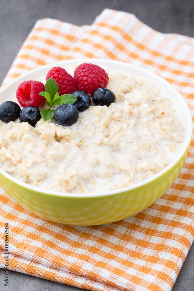 Oatmeal porridge in bowl with berries raspberries and blackberries. Oatmeal porridge in bowl with berries raspberries and blackberries.