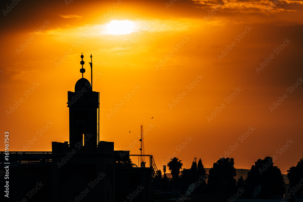 silhouetted minaret at marrakech, morocco