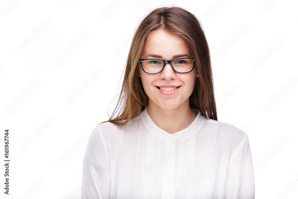 Beautiful young girl in glasses with a black rim a white shirt on an isolated background. Business concept
