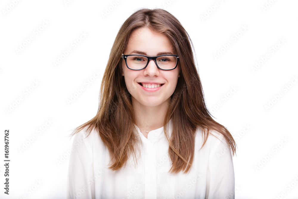 Beautiful young girl in glasses with a black rim a white shirt on an isolated background. Business concept Beautiful young girl in glasses with a black rim a white shirt on an isolated background. Business concept