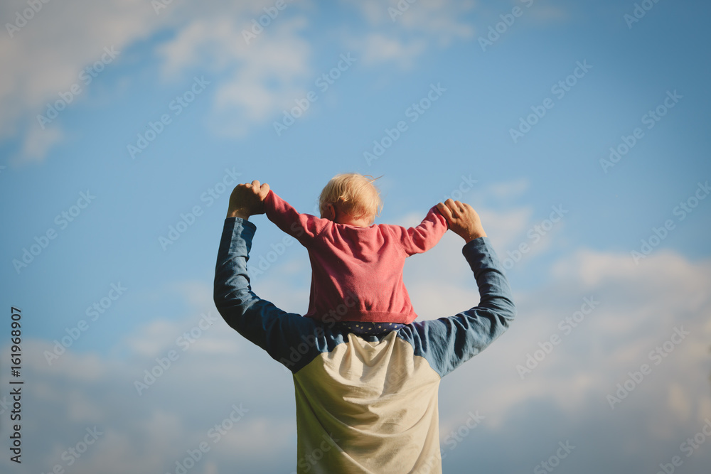 Father and little daughter play at sky Father and little daughter play at sky