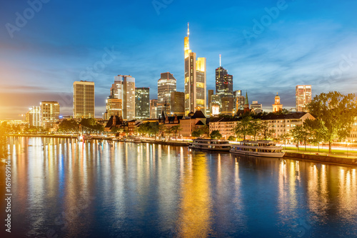 Beautiful panoramic cityscape view with illuminated skyscrapers during the twilight in Frankfurt  Germany