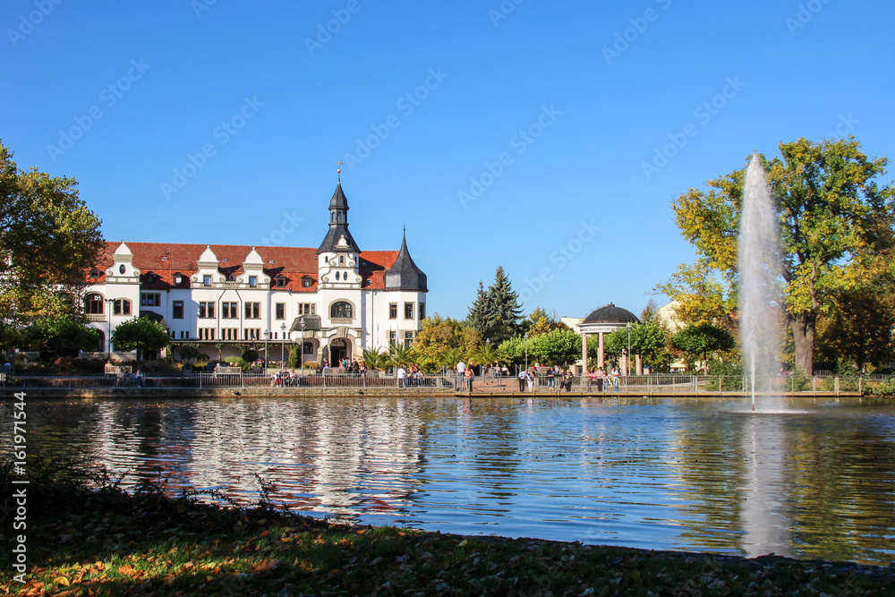 House by the lake with fountain