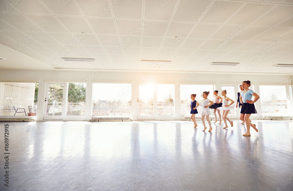 Fototapeta premium Group of children ballerinas practicing in ballet class