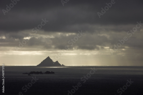 Skellig Islands in the rain off the western coasts of Ireland photo