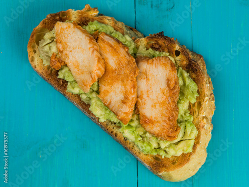 Fotografie Sliced Chicken and Avocado on Toasted Corn Bread