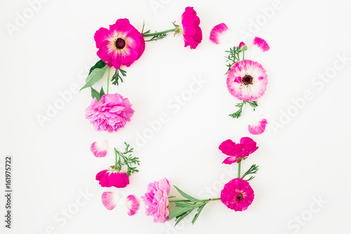Fototapeta Naklejka Na Ścianę i Meble -  Floral frame made of pink flowers, roses, peonies and leaves on white background. Floral composition. Flat lay, top view.