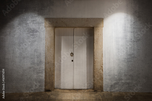 White wooden door over old grunge wall