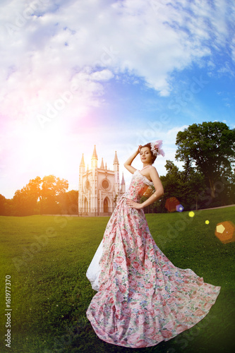 Princess in an vintage dress before the magic castle © Miramiska