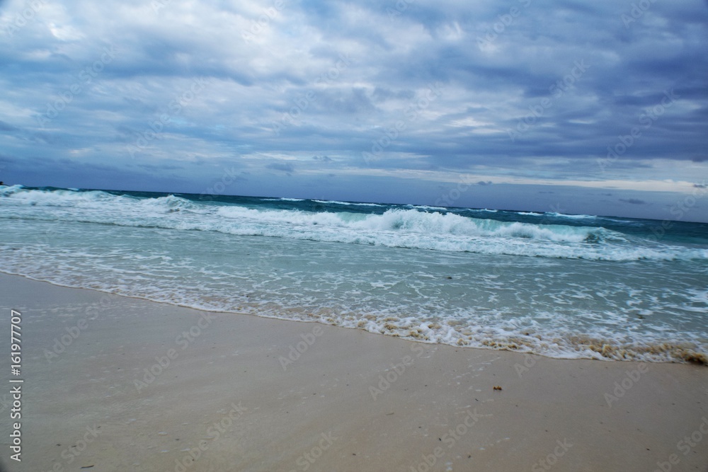 Paradise beach,Cuba. View of a perfect desert coast with withe sand and blue turquoise sea in a cloudy day