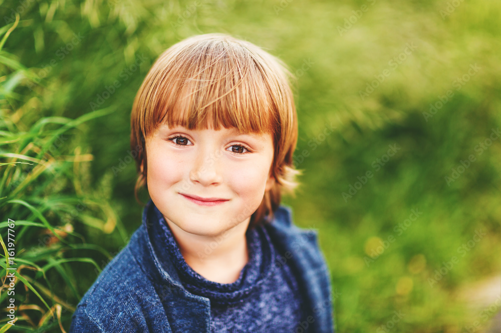 Outdoor portrait of adorable 6 year old kid boy Outdoor portrait of adorable 6 year old kid boy