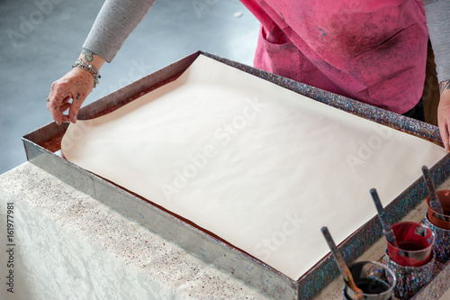 Tablou canvas The artisan creates the typical Florentine paper