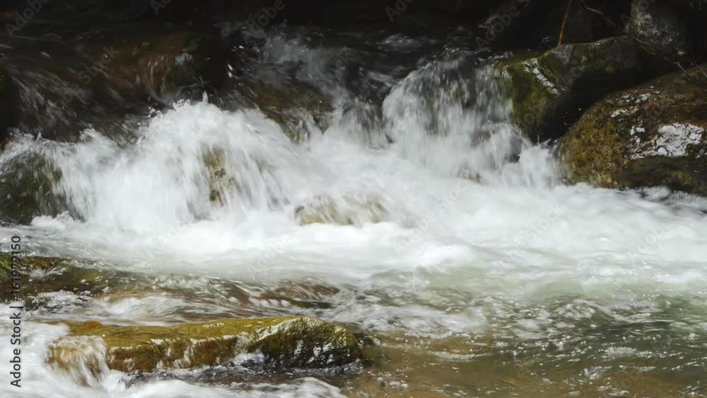 Waterfall in tropical rain forest in real time switching slow motion. nature background. Waterfall in tropical rain forest in real time switching slow motion. nature background.
