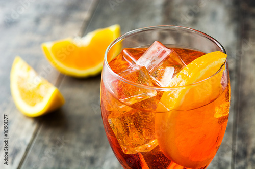 Aperol spritz cocktail in glass on wooden table
 photo