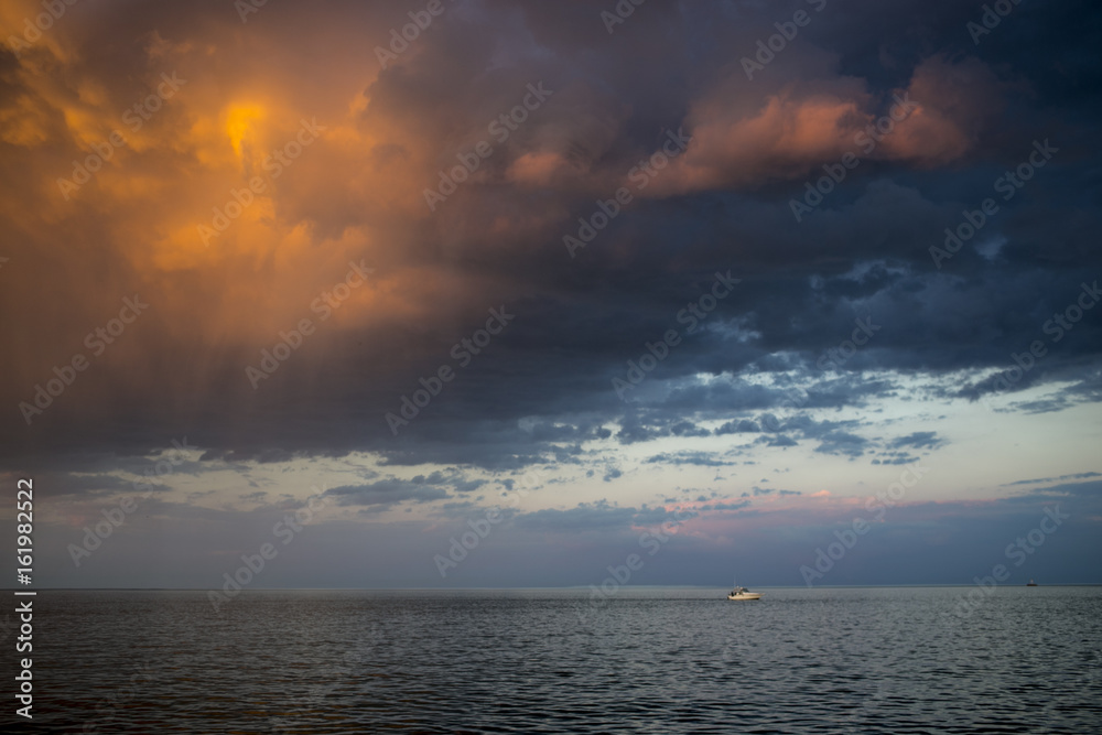 Sunset Reflecting off Storm Clouds over Water