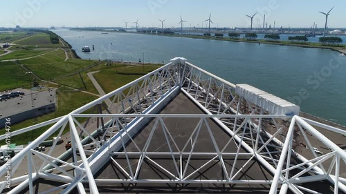 Aerial low flight over on of the arms of Maeslantkering storm surge barrier part of the Delta Works and one of largest moving structures on Earth low altitude flight over Maeslant Barrier arm 4k