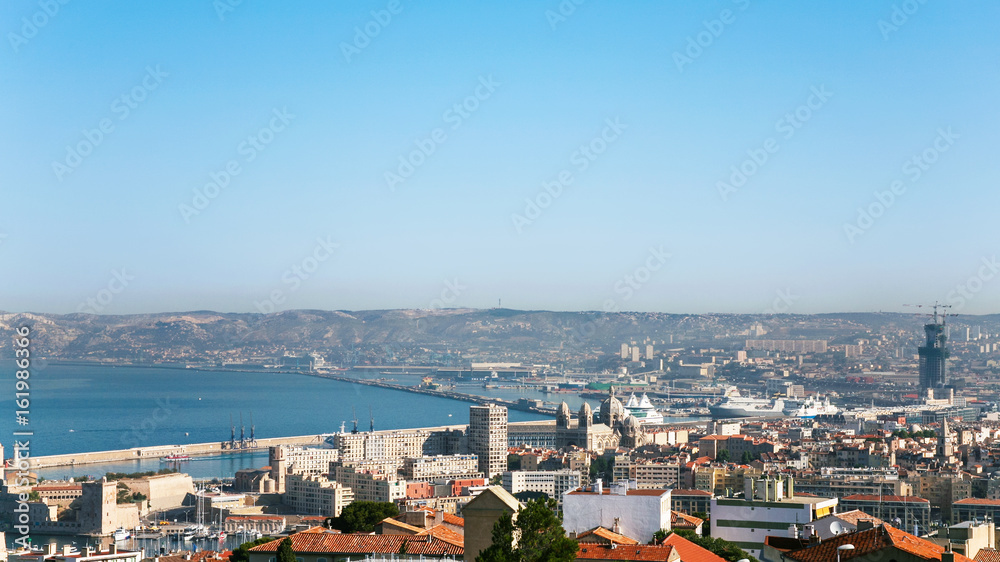 view of Marseilles city and port under blue sky