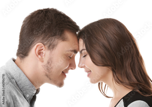 Beautiful young couple on white background, closeup