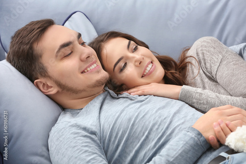 Beautiful young couple at home