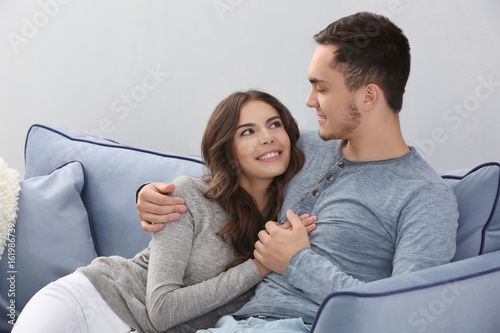 Beautiful young couple at home