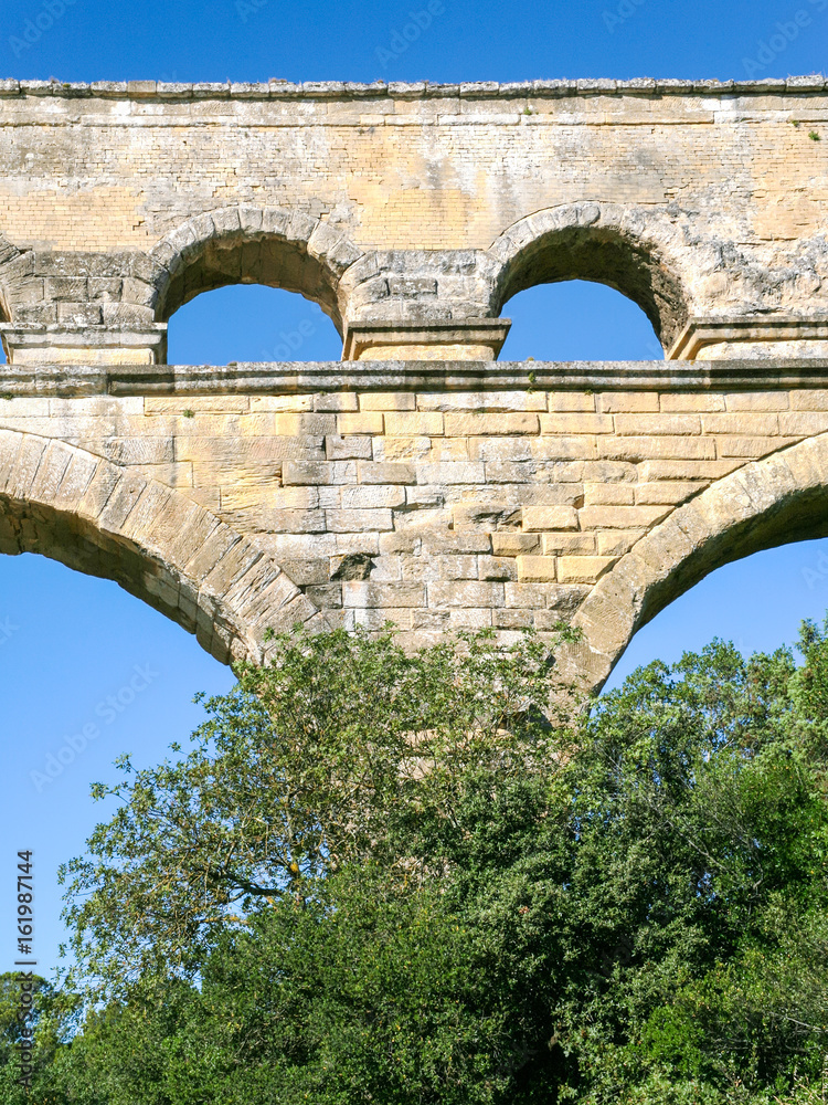 arch of ancient Roman aqueduct Pont du Gard