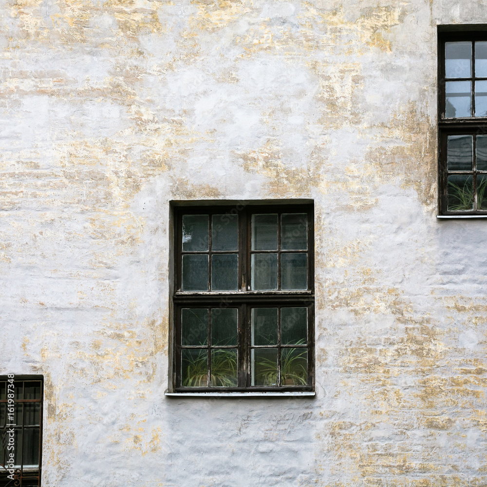 Fototapeta premium shabby facade of old house in Riga city