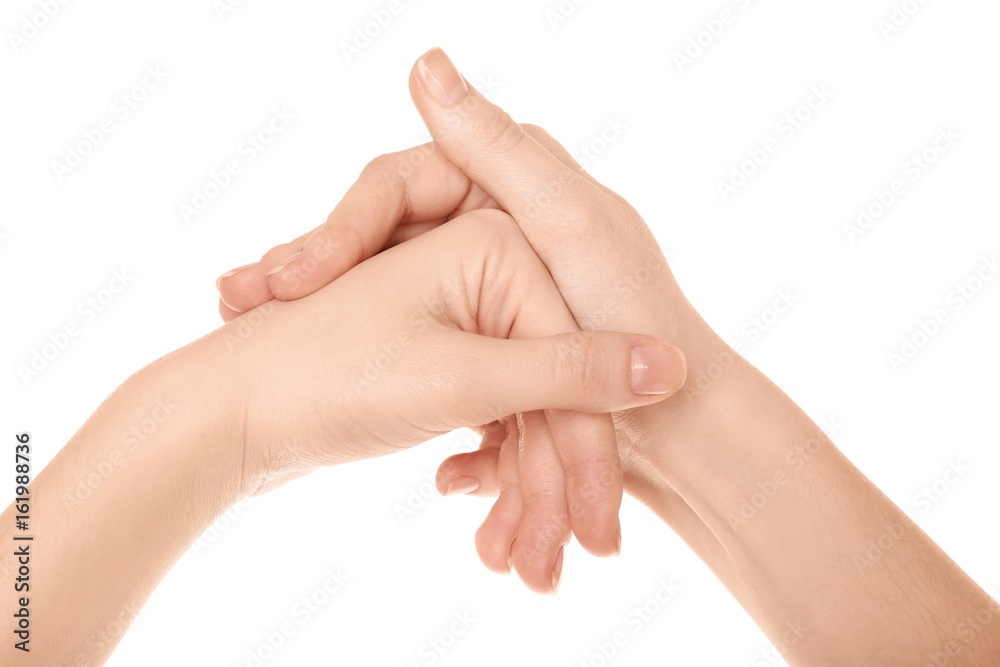 Hands of woman suffering from pain in joints on white background. Concept of orthopedist attendance