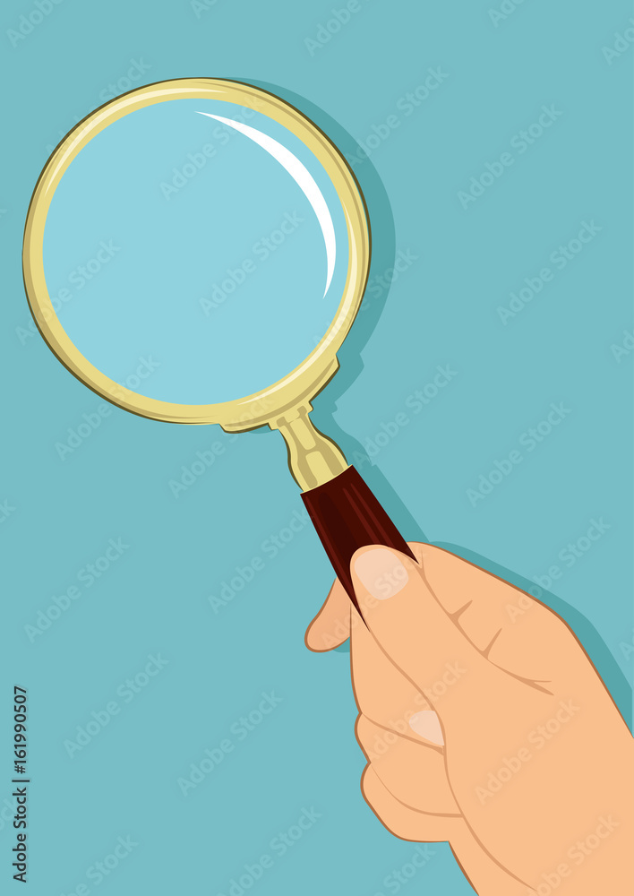 Male hand holding magnifying glass over blue background Male hand holding magnifying glass over blue background