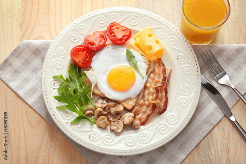 Tasty breakfast with egg on plate