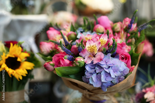 Colorful blooming bouquet of flowers in shop © Africa Studio