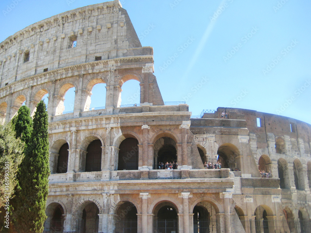 Colosseum or Coliseum (Flavian Amphitheatre) historic monument in Rome, Italy. World largest ancient amphitheatre built of concrete and sand. Famous european travel tourism landmark