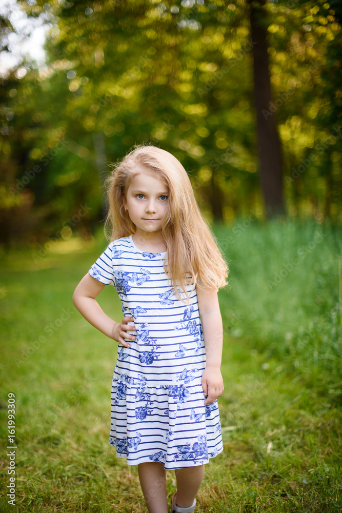 Portrait of a blonde girl outdoors in the park Portrait of a blonde girl outdoors in the park