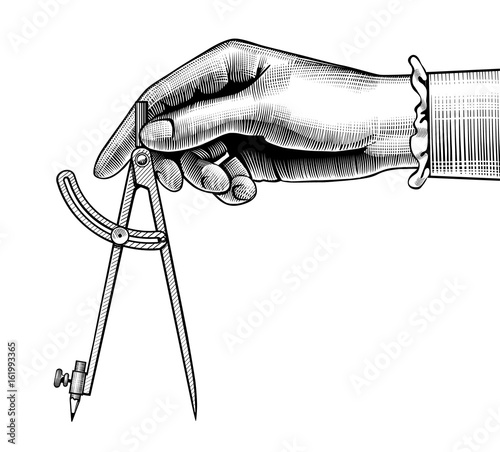 Woman's hand with a compass for drawing
