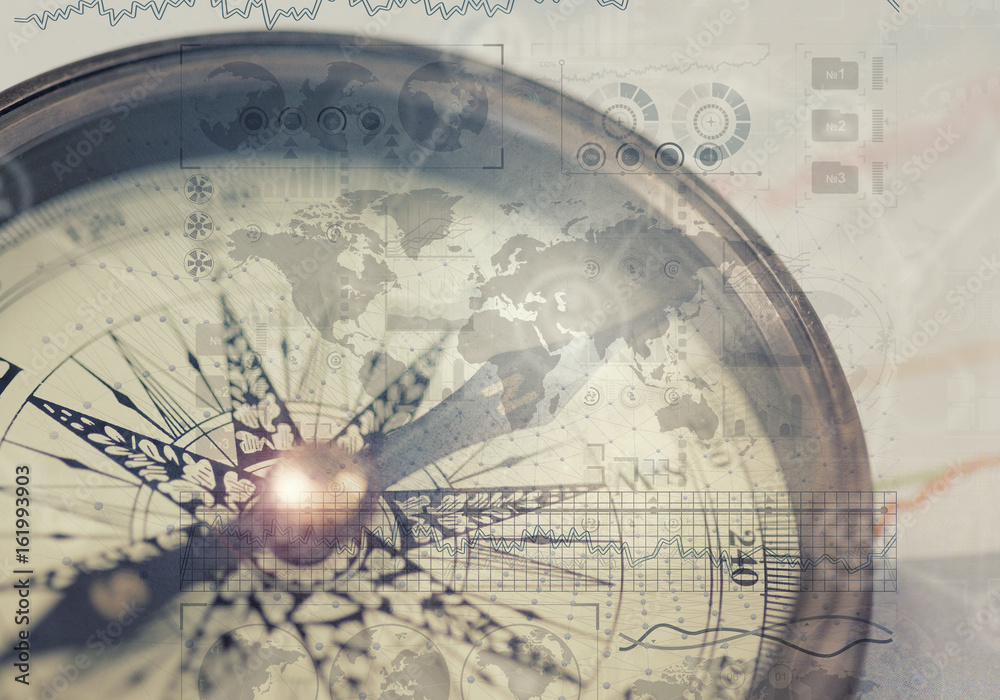 Fototapeta premium A compass and financial charts