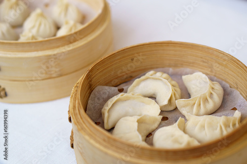 Chinese dumplings in bamboo steamer. Dumplings are among the most typical food in China