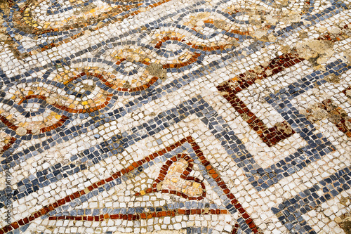 Heart detail of ancient mosaic on the street of Roman Archaeological site of Ephesus in Turkey.