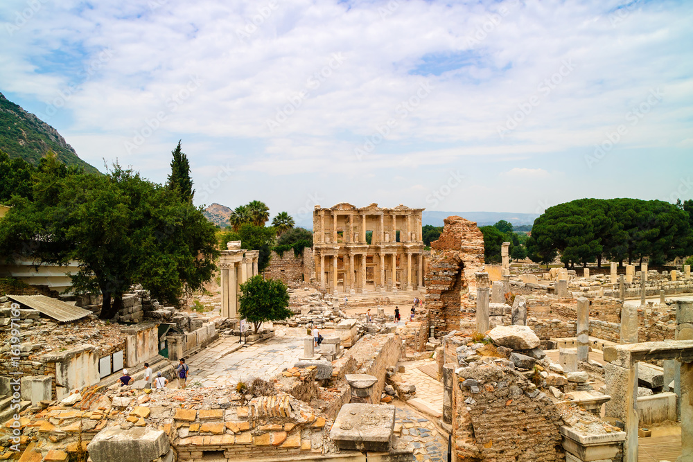 Ancient Roman Archaeological site with facade of the Library of Celsus in Ephesus, Anatolia a popular tourist attraction.