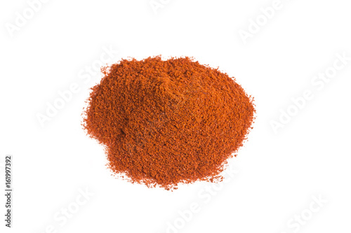 Heap of red paprika powder on white background