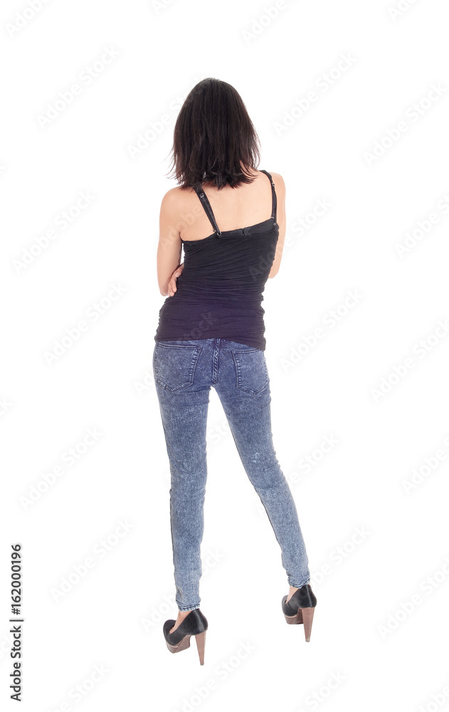 Woman standing in tights from the back. Woman standing in tights from the back.
