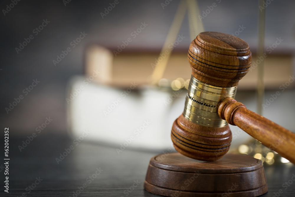 Symbols of the law on a rustic desk Symbols of the law on a rustic desk