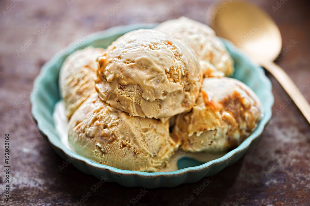 Salted caramel ice creams on blue plate Salted caramel ice creams on blue plate
