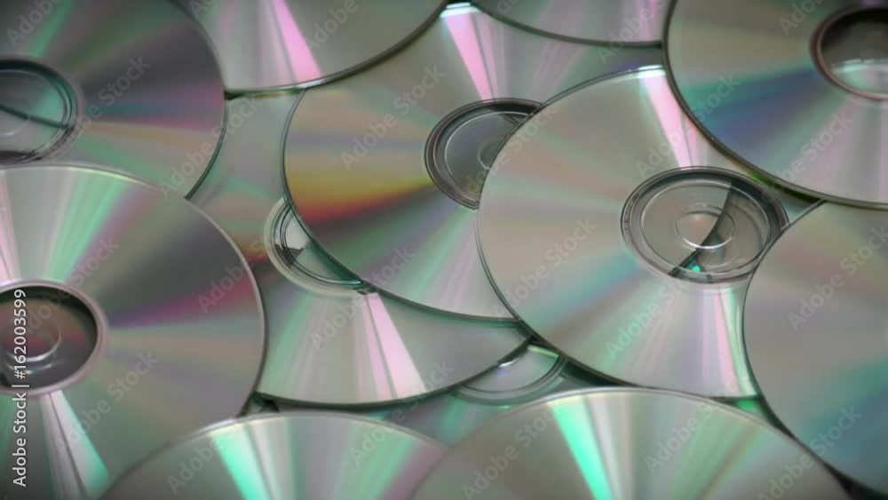 Compact Optical cd or Dvds Disks Rotating Slowly Compact Optical cd or Dvds Disks Rotating Slowly