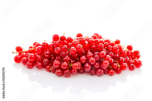 bunch ripe red currant isolated on white.