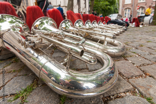 Composition of musical instruments on the ground in a row.