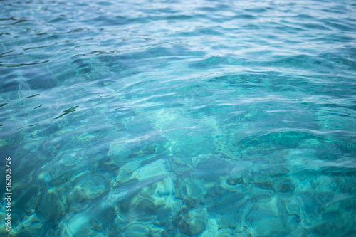 Transparent turquoise sea water, natural background. Emerald Coast, Sardinia, Italt.